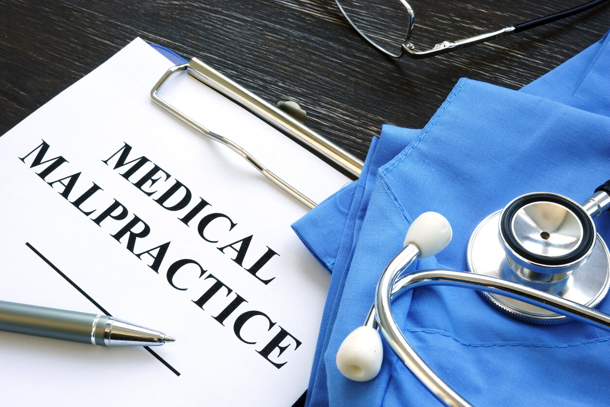 Medical malpractice. Medical suit, stethoscope and papers